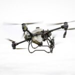 A drone flying over a rugged landscape, capturing geological survey data for analysis.